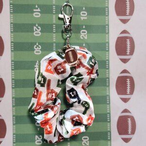 Football Themed Wristlet Keyring with a Football related charm attached !!